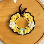 Close-up of artisan honeybee knit pet collar in yellow